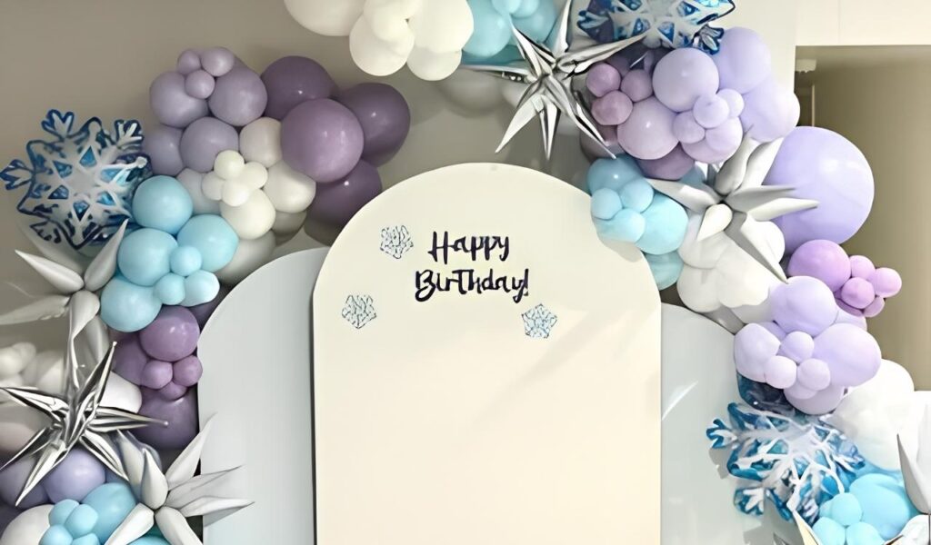 Frozen balloon arch decoration with blue white and silver balloons for birthday celebration
