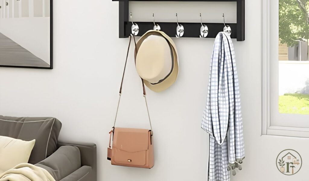 Small entryway decor with no closet using wall mounted hooks and storage bench