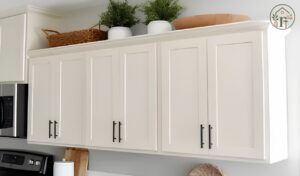 How to decorate above kitchen cabinets without clutter using baskets, vases, and greenery